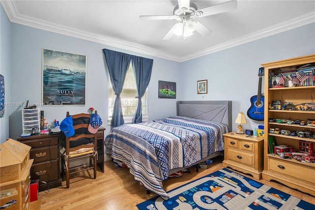 bedroom featuring ceiling fan, light hardwood / wood-style floors, and ornamental molding