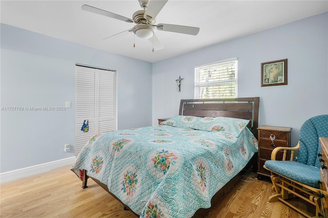 bedroom featuring a closet, hardwood / wood-style floors, and ceiling fan