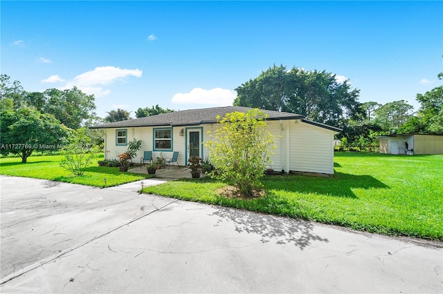 ranch-style home with a front lawn