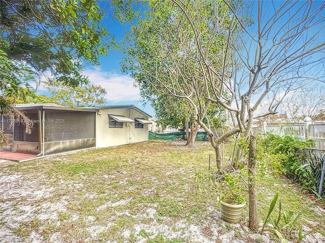 view of yard with a sunroom