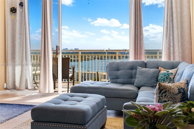 tiled living room with a water view