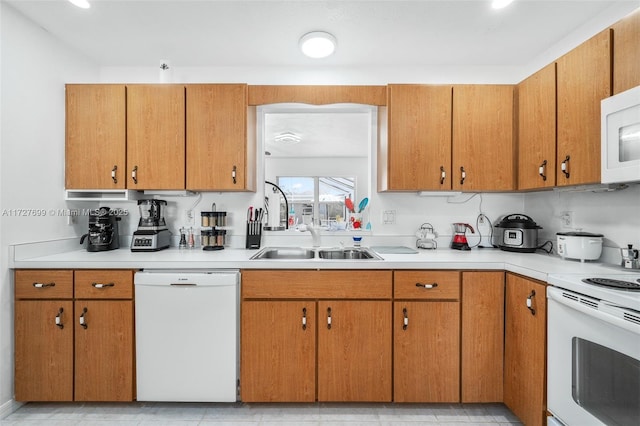 kitchen with sink and white appliances