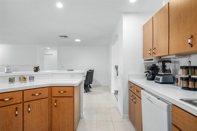 kitchen featuring light tile patterned flooring and dishwasher