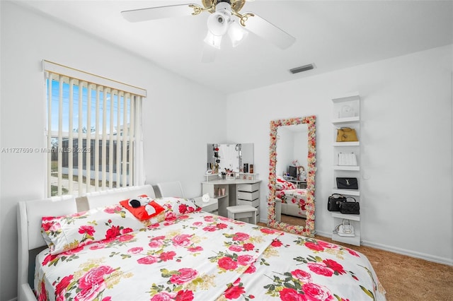 bedroom with ceiling fan and carpet