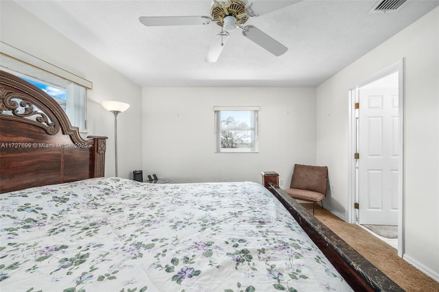 bedroom with ceiling fan and carpet