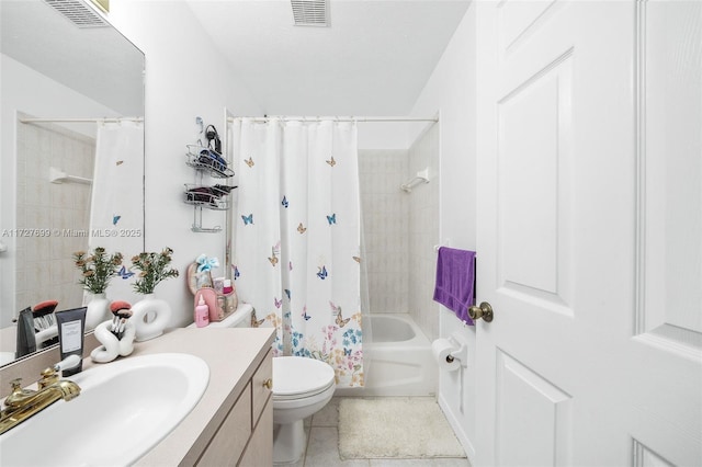 full bathroom featuring shower / bath combo with shower curtain, toilet, vanity, and tile patterned flooring