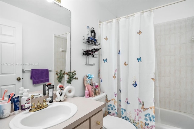 full bathroom featuring toilet, vanity, and shower / tub combo with curtain