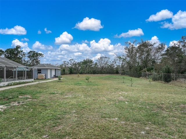 view of yard with a lanai