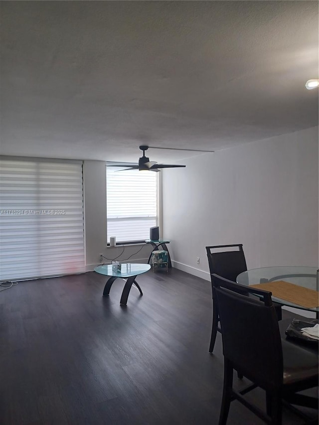 recreation room with ceiling fan and dark hardwood / wood-style flooring