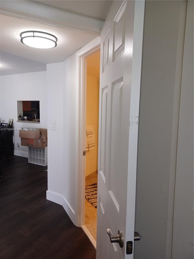 corridor featuring dark hardwood / wood-style flooring