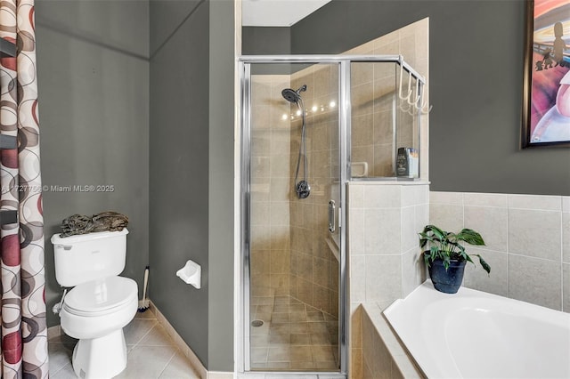 full bathroom with tile patterned floors, toilet, a shower stall, baseboards, and a bath