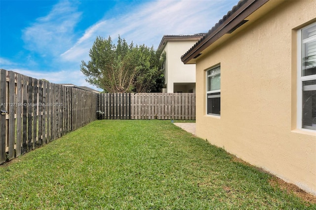 view of yard with a fenced backyard