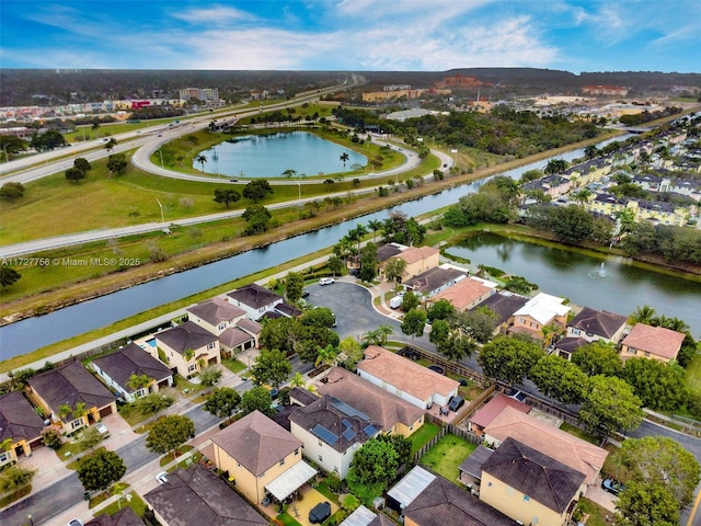 aerial view with a residential view and a water view