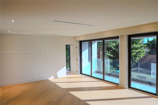 empty room with light hardwood / wood-style floors