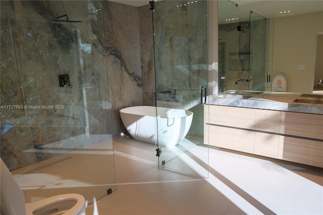 bathroom featuring vanity and shower with separate bathtub