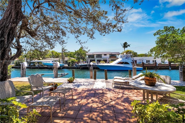 exterior space with a boat dock and a water view