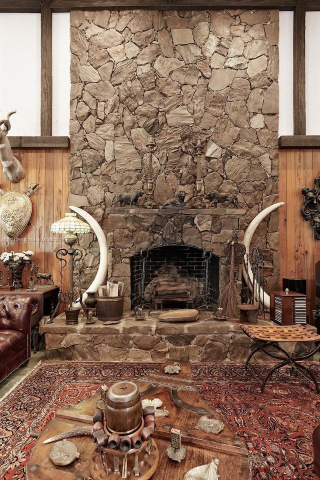 living room with a stone fireplace