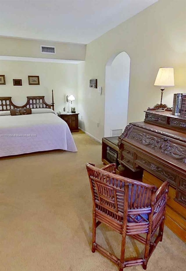 bedroom featuring light colored carpet