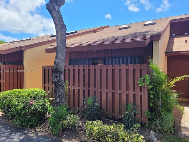 view of gate featuring fence