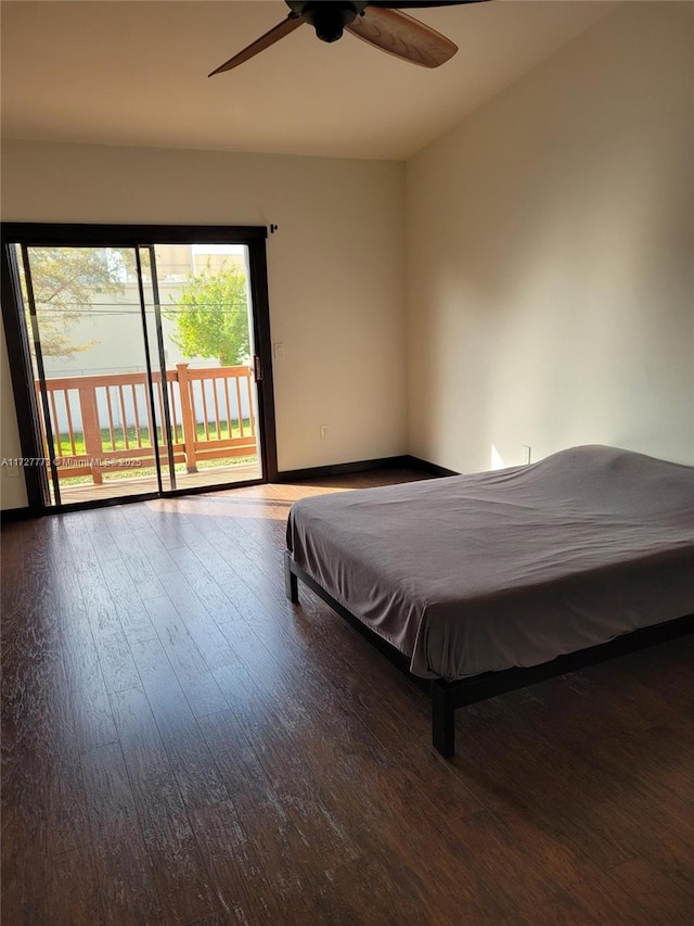 bedroom featuring hardwood / wood-style floors, a ceiling fan, baseboards, and access to outside