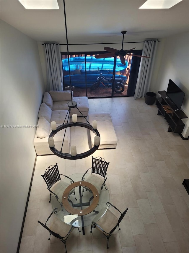 unfurnished dining area featuring ceiling fan