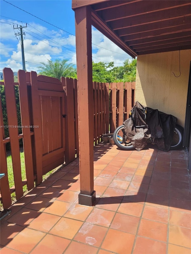 view of patio / terrace with a gate and fence