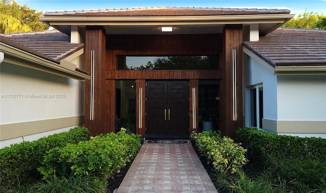 entrance to property featuring french doors