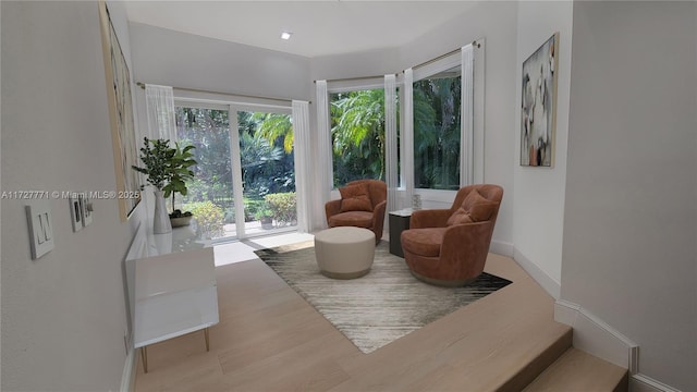 sitting room with light hardwood / wood-style flooring