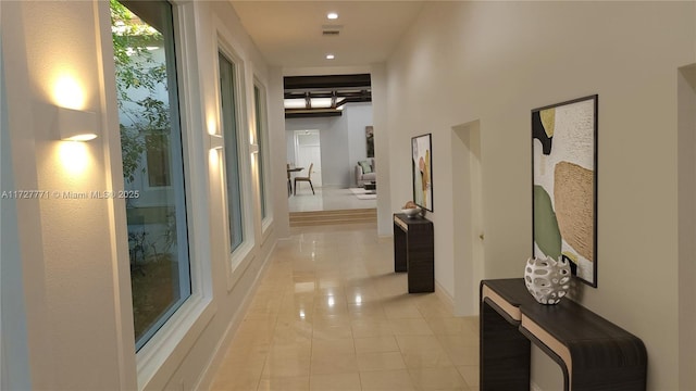 hallway featuring light tile patterned floors