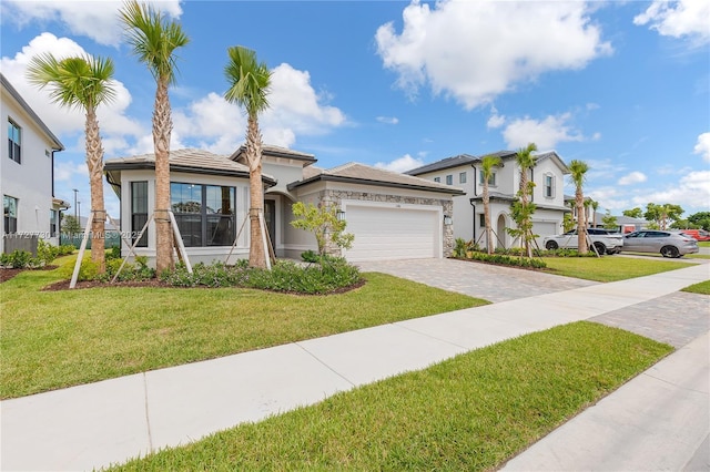 view of front of home featuring a garage and a front lawn