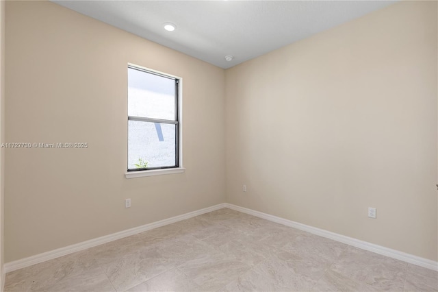 empty room featuring light tile patterned floors