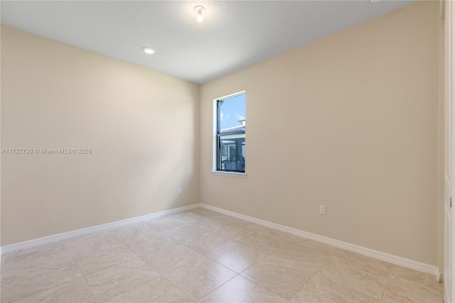 unfurnished room with light tile patterned floors