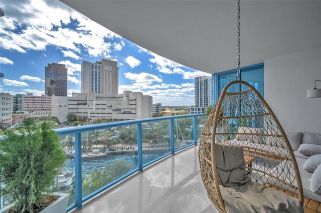 balcony featuring a water view