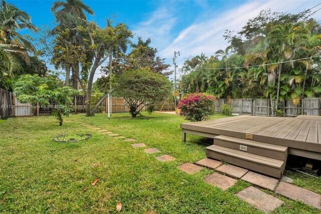 view of yard with a wooden deck