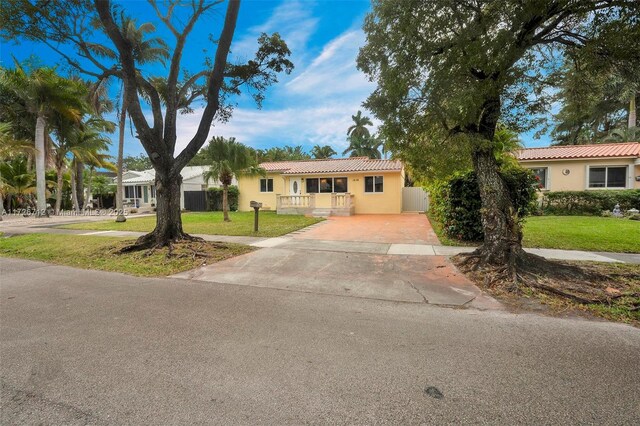 ranch-style house with a front yard