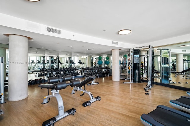 gym with hardwood / wood-style flooring