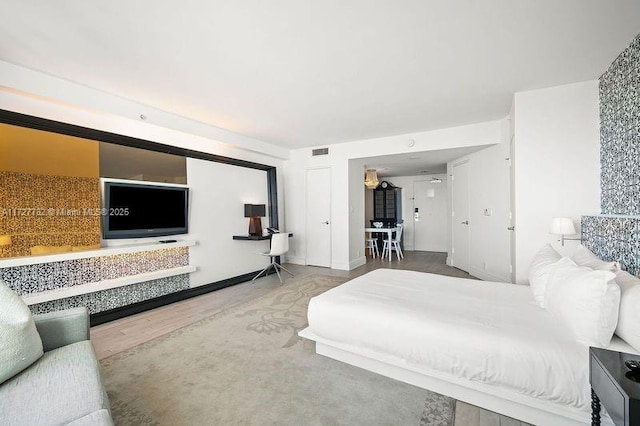 bedroom featuring wood-type flooring