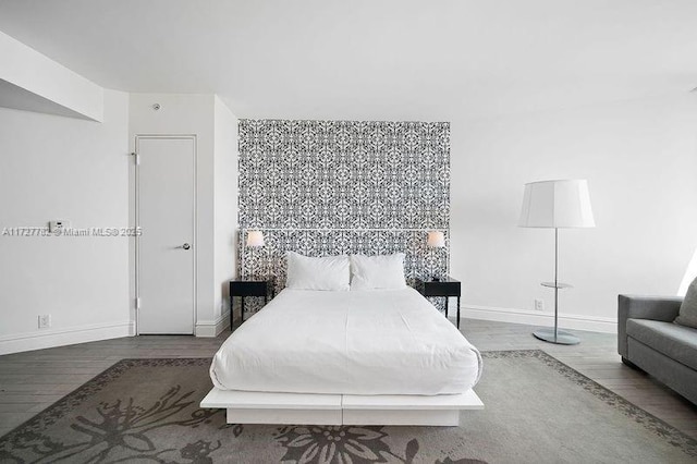 bedroom featuring dark wood-type flooring