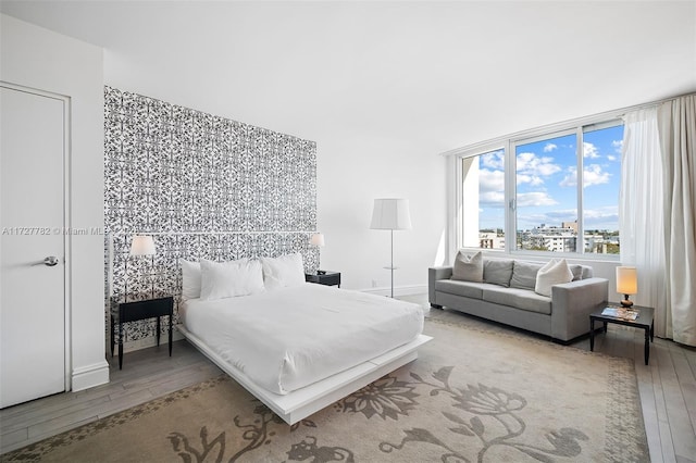 bedroom with hardwood / wood-style flooring