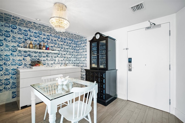 dining room with a notable chandelier