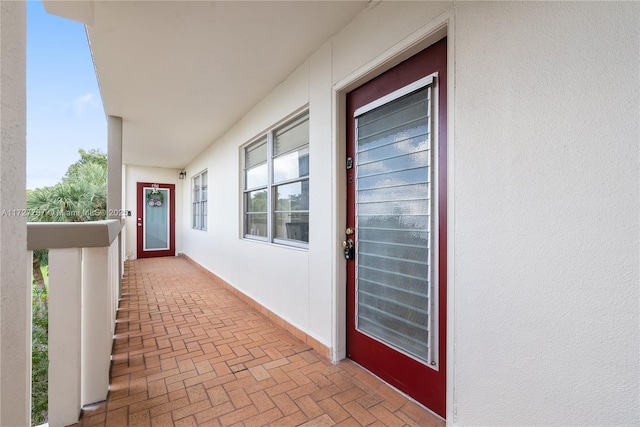 property entrance featuring stucco siding