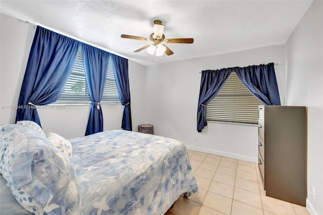 bedroom featuring ceiling fan and light tile patterned flooring