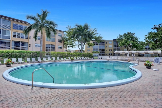 view of swimming pool with a patio