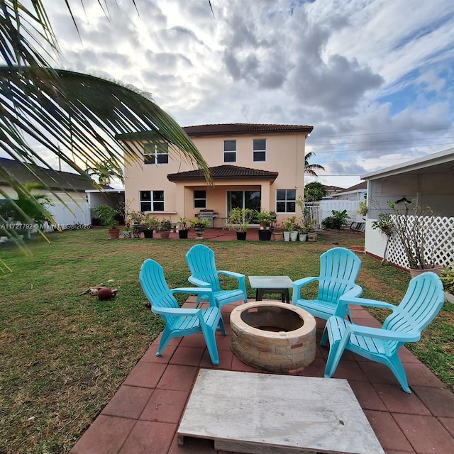 view of patio featuring fence and an outdoor fire pit