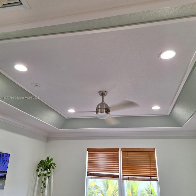 details with recessed lighting, a tray ceiling, a ceiling fan, and crown molding