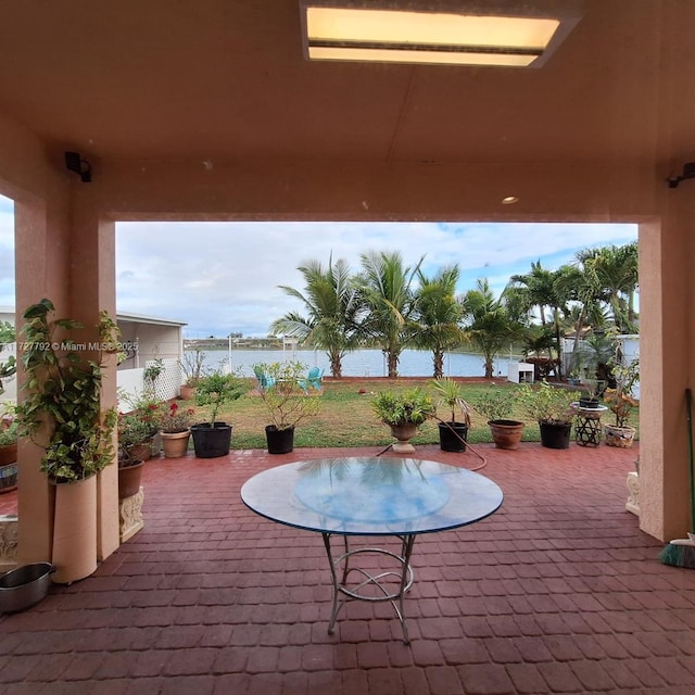 view of patio featuring a water view