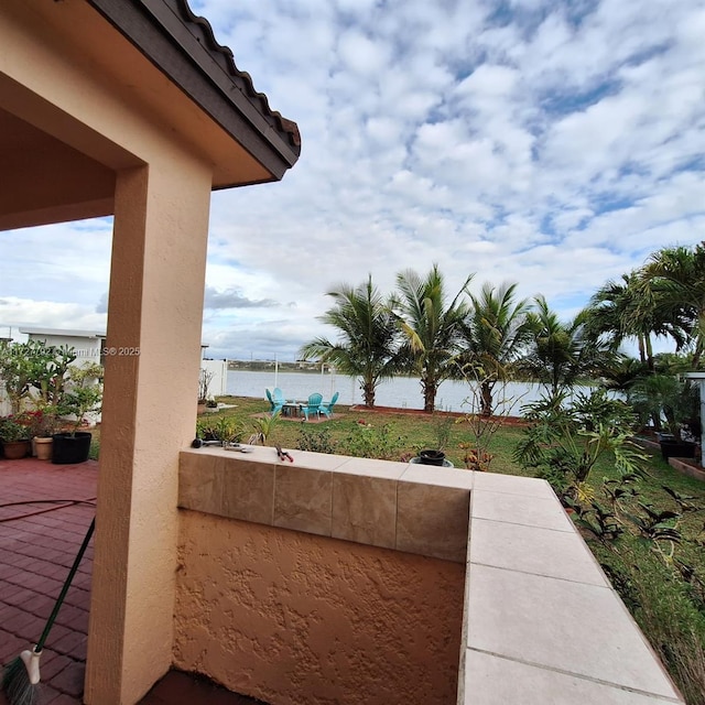 view of patio / terrace with a water view