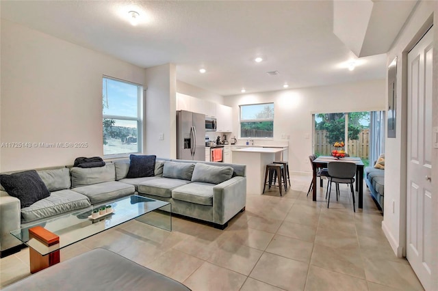 living room featuring light tile patterned floors