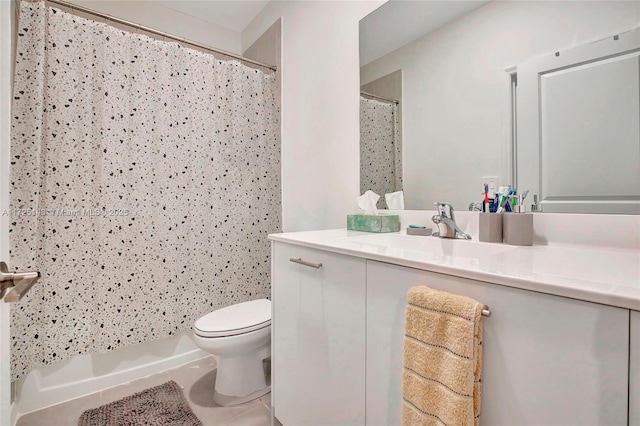 bathroom with tile patterned floors, toilet, vanity, and a shower with curtain