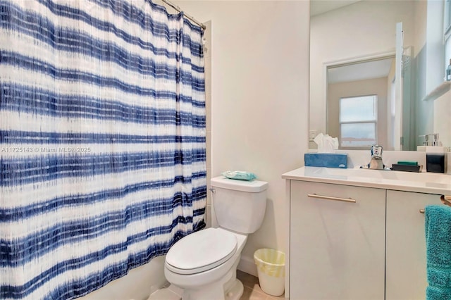 bathroom featuring toilet and vanity